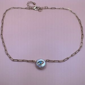 Gold necklace with pearl and eye designs